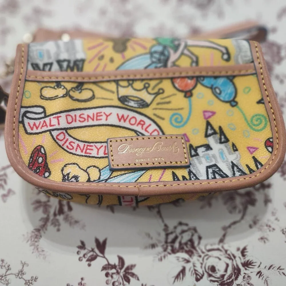 Disney Dooney and Bourke Mickey Dumbo Castle Yellow Flap Wristlet - Picture 2 of 2